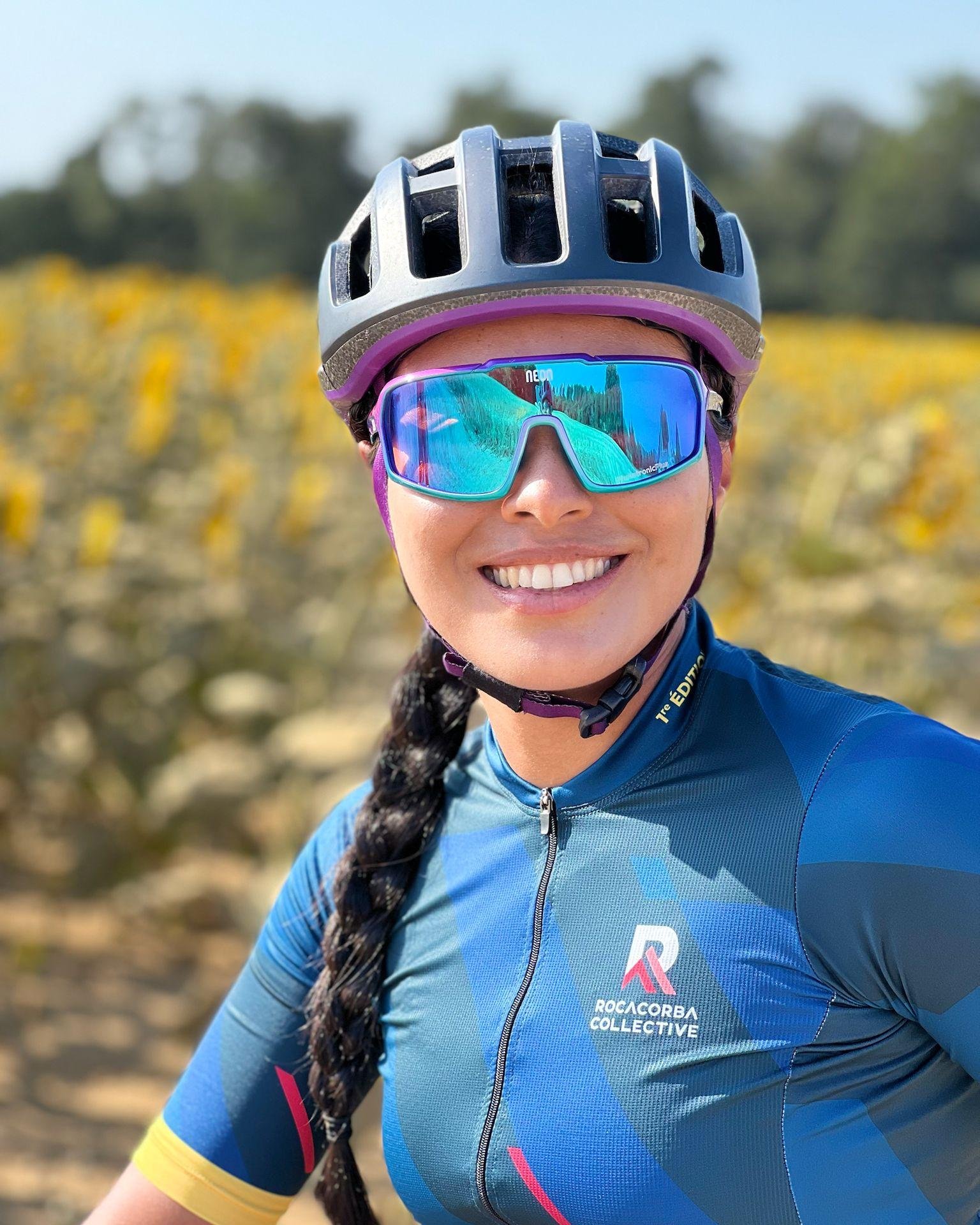 Daylin Miller of Middle Ground Cycling rides joyfully through Girona’s scenic countryside, reflecting her approachable style and passion for gravel cycling.