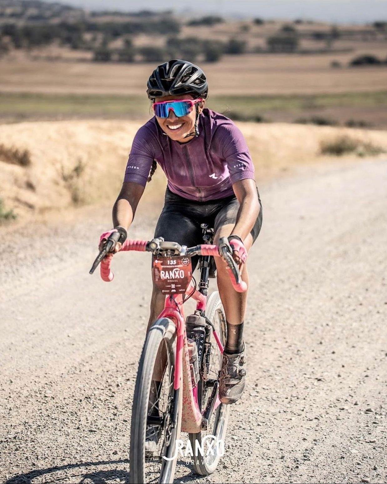 Daylin Miller powers through the dusty trails of the Ranxo Gravel Race in Spain, showcasing her strength, focus, and love for competitive gravel riding.
